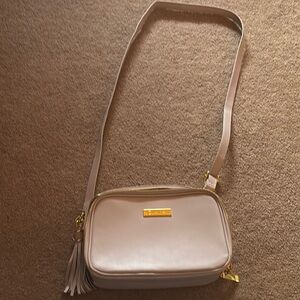 Joy and Iman Cream and Gold Crossbody Bag with Sleek Design